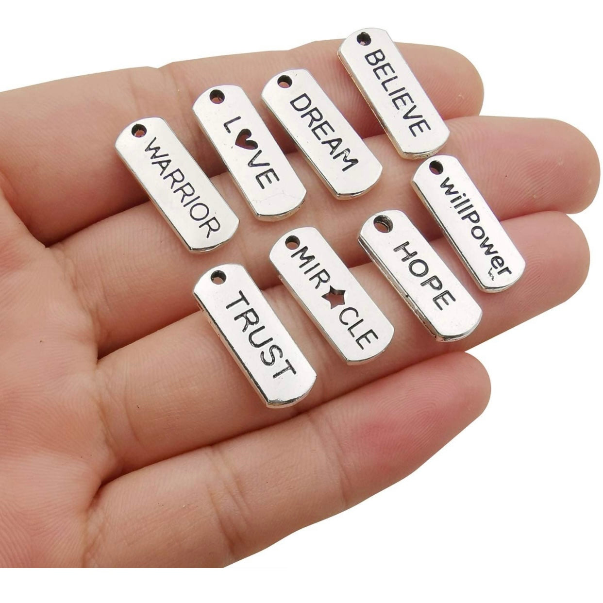 Positive affirmation charms in silver.
